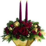 Ciotola con rose rosse e due candele a Roma